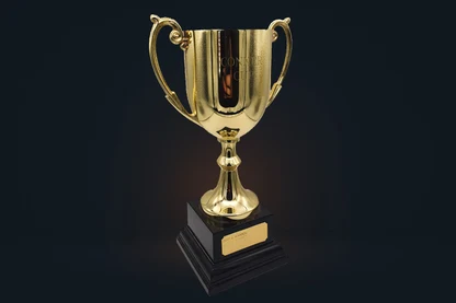 The Conker Cup trophy on a dark studio floor: a gold cup on a black plinth with a brass plaque.